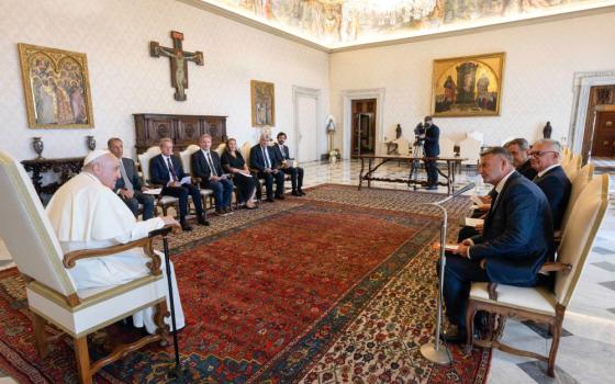 Pope Francis speaks to a delegation of European lawyers in the library of the Apostolic Palace at the Vatican Aug. 21, 2023.