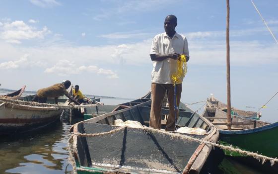 A fisherman spreads his net at the shores of Lake Victoria Jan. 26, 2022.
