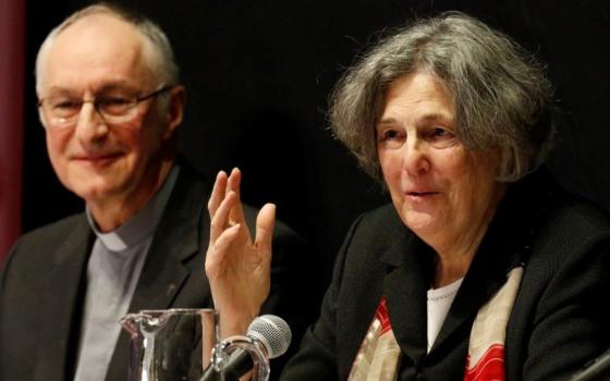 Phyllis Zagano speaks during a 2019 symposium on the history and future of women deacons at Fordham University. Looking on is Jesuit Fr. Bernard Pottier, a member of the Vatican's International Theological Commission.