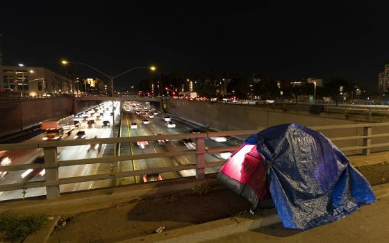 A tarp covers a portion of a homeless person's tent on a bridge overlooking the 101 Freeway Feb. 2 in Los Angeles. A study of homelessness in California released in June found that "a quarter (24%) of participants noted they could not find housing that meets their needs due to a physical disability; 14% indicated that this impacted their ability to find housing a lot." (AP photo/Jae C. Hong, File)
