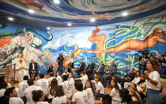 Pope Francis and Scholas Occurrentes' President Jose Maria del Corral, second from left, attend a meeting with members of the Scholas Occurrentes community of young people, an International educational movement created by Pope Francis himself, in Cascais, 25 kilometers south of Lisbon, Thursday, Aug. 3, 2023. (AP/Marco Bertorello)