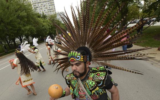 Members of the Cristo Rey Parish perform during the Parade of Faiths for the Parliament of the World's Religions, Aug. 13 in Chicago. (AP photo/Paul Beaty)