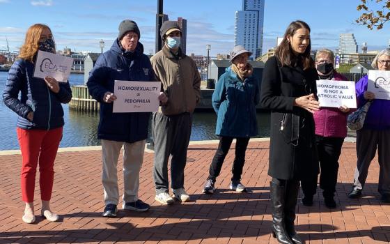 Sarah Pearson, in black jacket, was part of a group of sex abuse survivors who called on U.S. bishops, in a Nov. 16, 2021, news conference in Baltimore, to focus less on who can take Communion and instead do more about sex abuse. Survivors, outside the fall meeting of U.S. bishops, also said they were concerned with the "pernicious idea" from a group protesting nearby that homosexuality is linked to pedophilia and called on bishops and Pope Francis to denounce it. (CNS photo/Rhina Guidos)