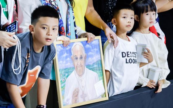 Children wait to see Pope Francis as he arrives at the Steppe Arena to celebrate Mass in Ulaanbaatar, Mongolia, Sept. 3. (CNS/Lola Gomez)