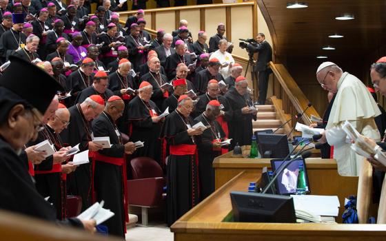 Pope Francis participates in morning prayer during a session of the Synod of Bishops on young people in this file photo from 2018. The first of two synods on synodality will convene in Rome on Oct. 4. (CNS/Vatican Media)