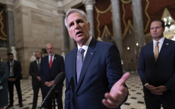 Speaker Kevin McCarthy, R-California, joined by other GOP members, talks to reporters just after voting to advance appropriations bills on the House floor, at the Capitol in Washington Sept. 26. (AP/J. Scott Applewhite)