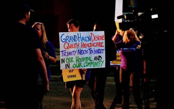 Small crowd. with someone holding a pro-union sign