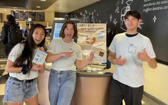 Three students active with University of San Diego’s Changemaker Hub, a partner of USD's Food Studies Initiative, pose at Aromas, a USD campus coffee shop, during April 2023's trial run of an oat milk default in drinks ordered at the café. (Courtesy of Aaron Gross)