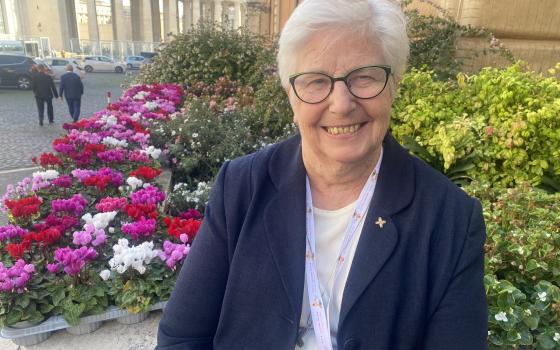 Loreto Sr. Patricia Murray, executive secretary of the International Union of Superiors General, waits outside Paul VI Hall at the Vatican before the start of the synod on Oct. 4.