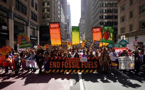 Activists mark the start of Climate Week in New York City Sept. 17, during a demonstration calling for the U.S. government to take action toward ending fossil fuel use in order to reduce the impact of global climate change. (OSV News/Reuters/Eduardo Munoz)