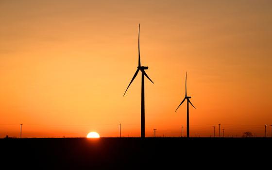 Wind turbines operate at sunrise in the Permian Basin oil and natural gas production area in Big Spring, Texas, Feb. 12, 2019. (CNS/Reuters/Nick Oxford)