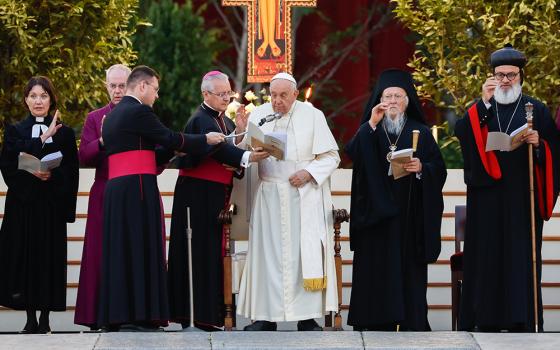 Pope Francis and other Christian leaders give their blessing at the end of an ecumenical prayer vigil in St. Peter's Square Sept. 30, ahead of the Synod of Bishops assembly: from left, are the Rev. Ann Burghardt, general secretary of the Lutheran World Federation; Anglican Archbishop Justin Welby of Canterbury; Francis; Orthodox Ecumenical Patriarch Bartholomew of Constantinople and Syriac Orthodox Patriarch Ignatius Aphrem II. (CNS/Lola Gomez)