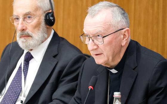 Cardinal Pietro Parolin, Vatican secretary of state, speaks at the conference "New Documents from the Pontificate of Pope Pius XII" as Rabbi Riccardo Di Segni listens at the Pontifical Gregorian University in Rome, Oct. 9. (CNS/Lola Gomez)