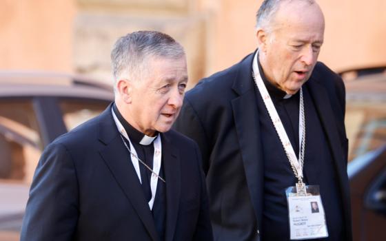 Cardinal Blase J. Cupich of Chicago and Cardinal Robert W. McElroy of San Diego and arrive for a session of the assembly of the Synod of Bishops in the Vatican's Paul VI Audience Hall Oct. 17, 2023. (CNS photo/Lola Gomez)