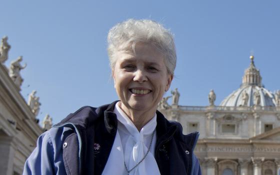 Loretto Sr. Jeannine Gramick poses for a photo in front of St. Peter's Basilica at the Vatican, after she and New Ways Ministry pilgrims attended Pope Francis' weekly general audience Feb. 18, 2015. (AP/Andrew Medichini)