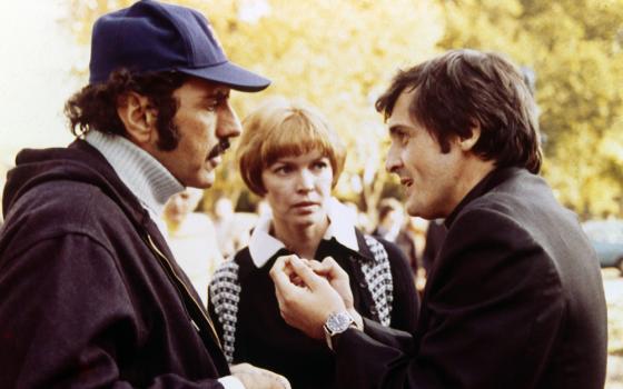 William Peter Blatty, left, speaks with actors Ellen Burstyn and Jason Miller on the set of "The Exorcist" in 1973. (Newscom/Warner Bros./Hoya Productions)