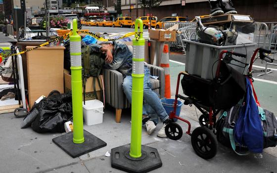 A homeless person in New York City sleeps among belongings Aug. 31, 2020. (CNS/Reuters/Mike Segar)