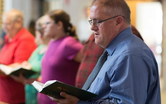 Daniel Markham prays during Mass at St. Michael Catholic Church in St. Michael, Minnesota, June 13, 2021, during his "52 Masses" tour. (CNS/The Catholic Spirit/Dave Hrbacek)