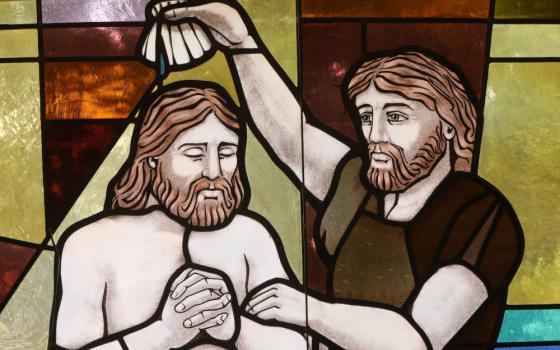The baptism of Christ by John the Baptist is depicted in a stained-glass window at St. Anthony's Church in North Beach, Md.. July 15, 2021. (OSV News photo/CNS file, Bob Roller)