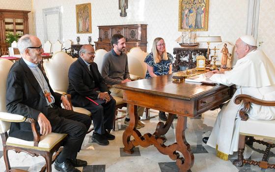 Pope Francis meets with leaders of the Laudato Si' Movement in the library of the Apostolic Palace at the Vatican Nov. 6. From left to right: Cardinal Michael Czerny, prefect of the Dicastery for Promoting Integral Human Development, Jesuit Fr. Xavier Jeyaraj, Tomas Insua and Lorna Gold. (CNS/Vatican Media)