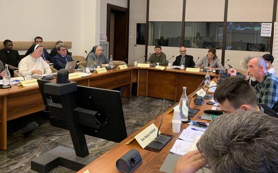 At the Dicastery for Promoting Integral Human Development at the Vatican Nov. 24, participants discuss Pope Francis' exhortation Evangelii Gaudium on the 10th anniversary of its publication. (CNS/Cindy Wooden)