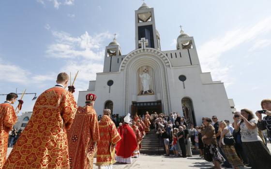 Clergymen into the Patriarchal Cathedral of the Resurrection of Christ in Kiev, Ukraine, June 5, 2017. The cathedral and its curia buildings sustained damage during a massive Nov. 25, 2023, drone attack by Russian forces on Kyiv. (OSV News photo/Valentyn Ogirenko, Reuters)