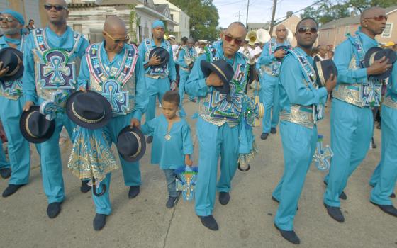 The group Black Men of Labor is seen marching and singing "Amazing Grace" during their annual second line parade in the documentary "City of a Million Dreams." (Courtesy of Spirit Tide Productions)