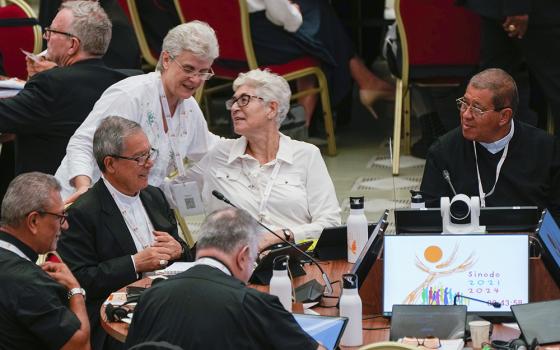 Participants of the 16th General Assembly of the Synod of Bishops attend a daily session with Pope Francis, not shown, in the Paul VI Hall at the Vatican, Oct. 16. (AP/Domenico Stinellis)