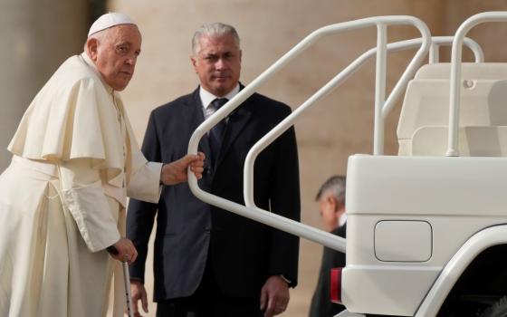 Pope Francis leaves at the end of the weekly general audience in St. Peter's Square, at the Vatican, Wednesday, Nov. 15, 2023. (AP Photo/Gregorio Borgia)