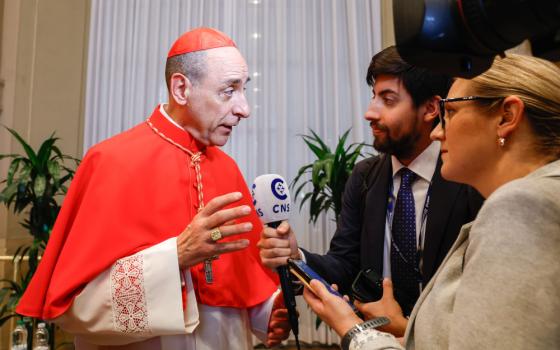 Cardinal Víctor Manuel Fernández comments on changes in the Dicastery for the Doctrine of the Faith, where he serves as prefect, as meets a CNS reporter in the Apostolic Palace at the Vatican after Pope Francis made him a cardinal Sept. 30, 2023. (CNS photo/Lola Gomez)