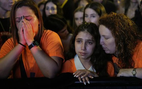 Relatives and friends of hostages held in the Gaza Strip by the Hamas militant group call for their release in the Hostages Square at the Museum of Art in Tel Aviv, Israel, Dec. 2. (AP/Ariel Schalit)