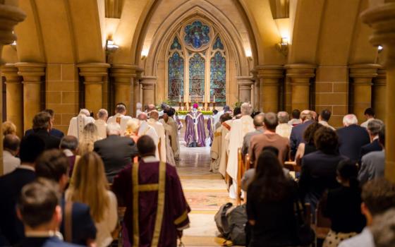 Archbishop Anthony Fisher of Sydney, principal celebrant, prays at a memorial Mass for Cardinal George Pell Jan. 10, a year after Pell died at 81.