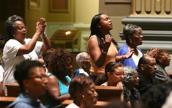 Black Catholics participate in a revival in the Cathedral Basilica of Sts. Peter and Paul in Philadelphia in this undated photo. (CNS/CatholicPhilly.com/Sarah Webb)