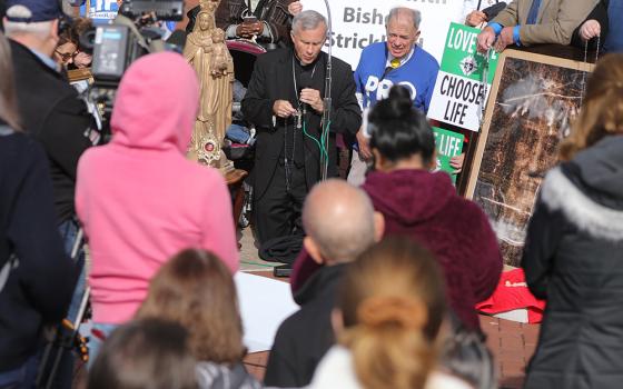 Bishop Joseph Strickland, who was removed from pastoral governance of the Diocese of Tyler, Texas, by Pope Francis Nov. 11, 2023, leads the recitation of the rosary Nov. 15 outside the site of the fall general assembly of the U.S. Conference of Catholic Bishops in Baltimore. (OSV News/Bob Roller)