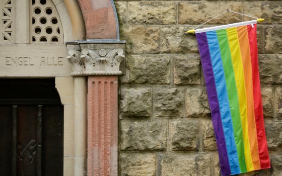 A rainbow flag is seen on the wall of a Catholic church in Cologne, Germany, May 10, 2021, as the building is open for same-sex couples to receive a blessing. Pope Francis formally approved letting Catholic priests bless same-sex couples, the Vatican announced Dec. 18, 2023. (OSV News photo/Thilo Schmuelgen, Reuters)