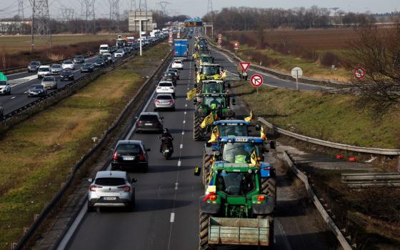 French farmers drive their tractors in a go-slow operation in Compans Jan. 27, 2024, near Roissy Charles-de-Gaulle Airport in a protest over price pressures, taxes and green regulation, grievances shared by farmers across Europe, (OSV News photo/Benoit Tessier, Reuters)