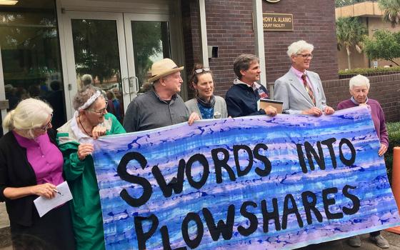 Members of the Kings Bay Plowshares — from left, Martha Hennessy, Mark Colville, Clare Grady, Carmen Trotta, Patrick O'Neill and Liz McAlister — stand outside the U.S. District Courthouse in Brunswick, Georgia, on Oct. 24, 2019, just after the trial on charges related to their 2018 protest against nuclear weapons. (Wikimedia Commons/Bones Donovan)