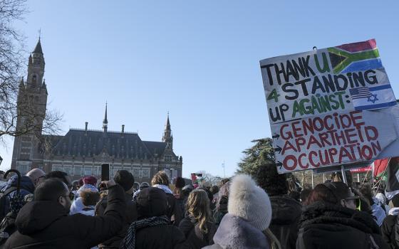 Pro-Palestinian activists gather near the International Court of Justice, or World Court, Jan. 26 in The Hague, Netherlands. The United Nations' top court has decided not to throw out genocide charges against Israel for its military offensive in Gaza. (AP photo/Patrick Post)