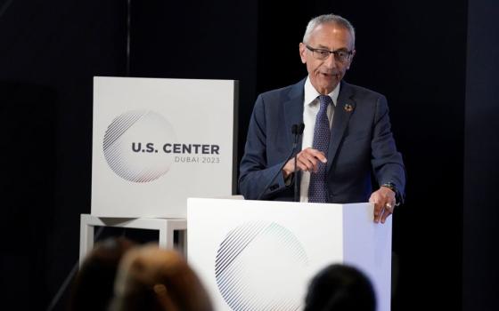 John Podesta, senior adviser to the president for Clean Energy Innovation and Implementation, speaks at the U.S. Center at the COP28 U.N. Climate Summit on Dec. 2 in Dubai, United Arab Emirates.