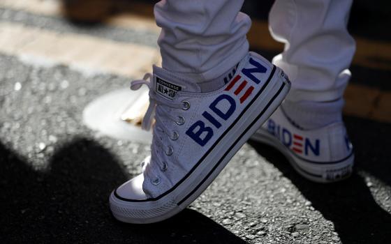 A Joe Biden supporter in San Francisco wears sneakers with his name on them Nov. 7, 2020, after news media declared the Democrat the winner of the presidential election. (CNS/Reuters/Stephen Lam)