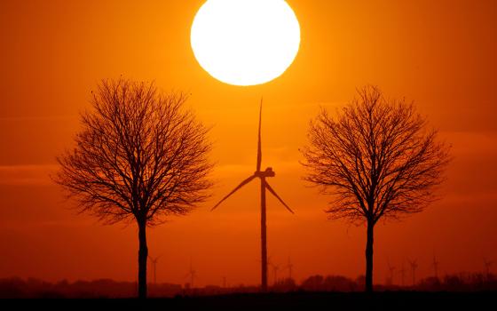 Windmill turbines are seen in this illustration photo. Since the U.S. church owns nearly 100,000 buildings, Catholic decarbonization could shift local energy markets and show society the morality of decarbonization. (CNS/Reuters/Pascal Rossignol)