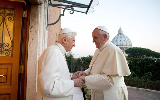 Pope Francis greets retired Pope Benedict XVI at the retired pontiff's Vatican residence Dec. 23, 2013. (OSV News/Vatican Media)