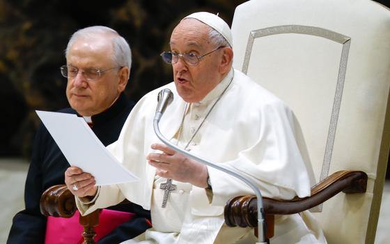 Pope Francis talks to visitors during his weekly general audience in the Paul VI Audience Hall at the Vatican Feb. 14, 2024. (CNS/Lola Gomez)