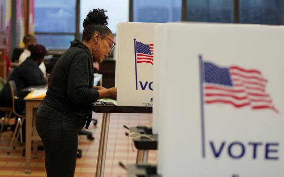 A woman casts her ballot at a polling station in Detroit as Democrats and Republicans held their Michigan presidential primary Feb. 27. (OSV News/Reuters/Dieu-Nalio Chery)