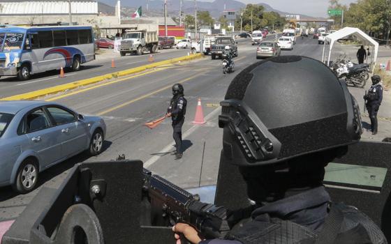 State police maintain a security checkpoint at the entrance of Chilpancingo, Mexico, Feb. 15, 2024. Four Roman Catholic bishops met with Mexican drug cartel bosses in a bid to negotiate a possible peace accord, according to the Bishop of Chilpancingo-Chilapa, José de Jesús González Hernández. (AP/Alejandrino Gonzalez)