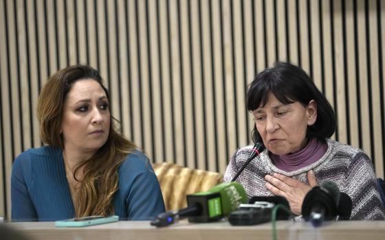 Lawyer Laura Sgro, left, listens to Gloria Branciani during a press conference in Rome Feb. 21, 2024. Gloria Branciani, 59, is one of the first women who accused Fr. Marko Rupnik, a once-exalted Jesuit artist of spiritual, psychological and sexual abuse. (AP/Alessandra Tarantino)