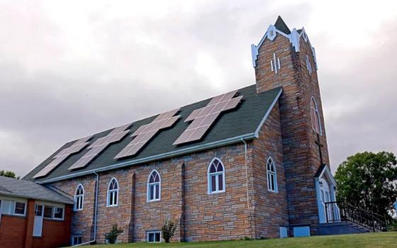 a church with solar panels on the roof. Education Images / Universal Images Group / Getty Images