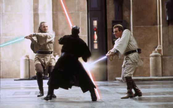 Jedi Qui-Gon Jinn (Liam Neeson), left, and his apprentice Obi-Wan Kenobi (Ewan McGregor) take on Sith Lord Darth Maul (Ray Park) in ''Star Wars: Episode I — The Phantom Menace.'' (CNS/Lucasfilm)