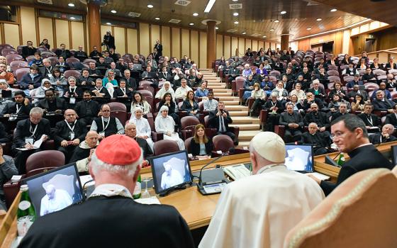 Pope Francis, seated next to Cardinal Marc Ouellet, president of the Center for Research and Anthropology of Vocations and retired prefect of the Dicastery for Bishops, speaks at an international congress titled, "Man-Woman: Image of God. For an Anthropology of Vocations," in the Synod Hall at the Vatican March 1, 2024. (CNS/Vatican Media)