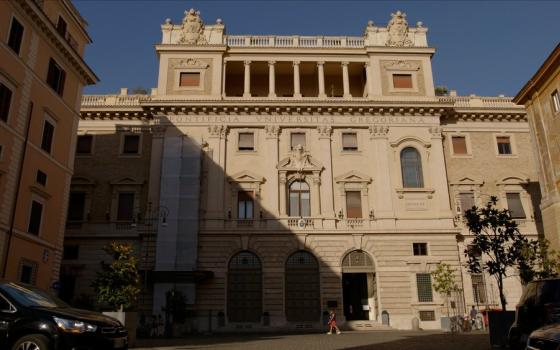 Imposing stone facade half in shadow